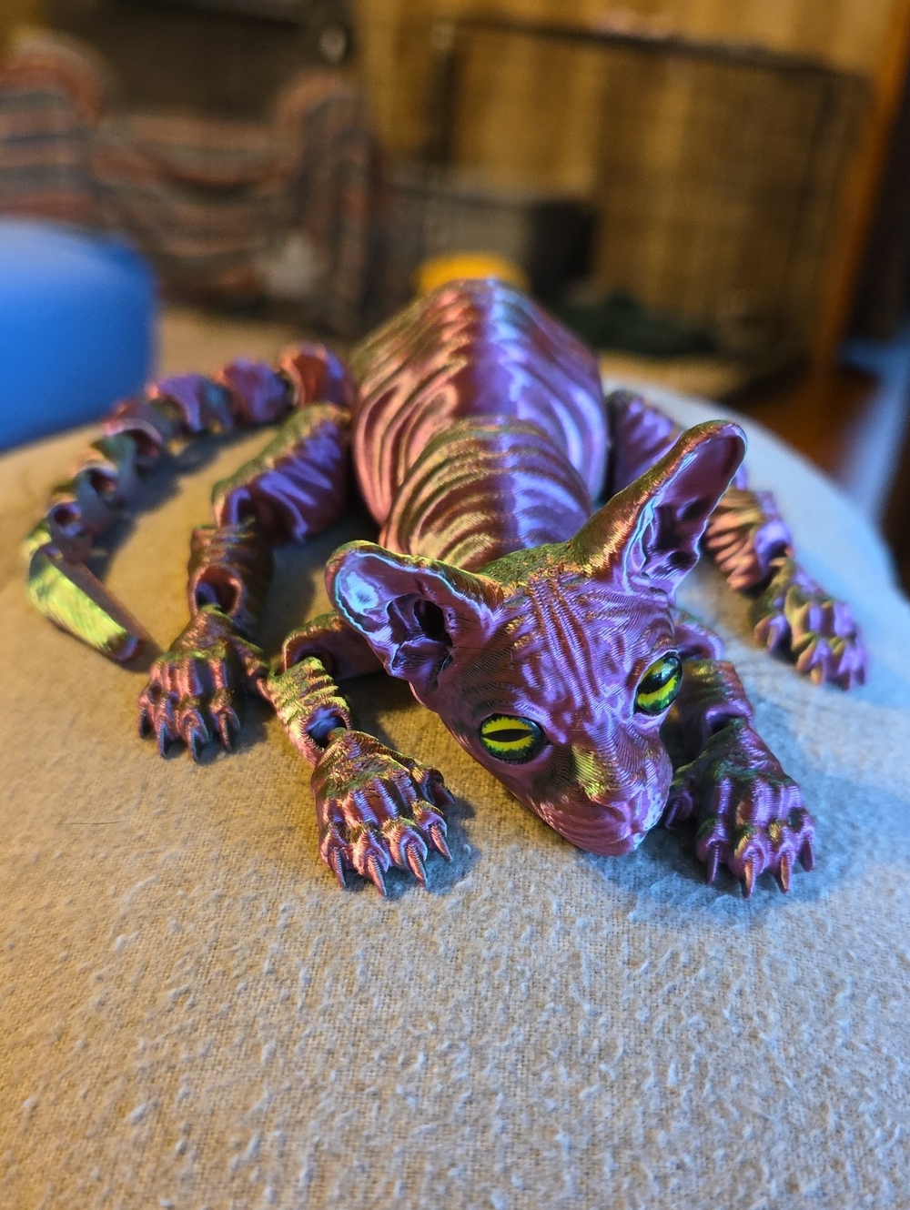 Iridescent Purple Sphynx Cat Figurine with Green Eyes